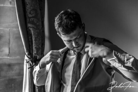 Groom getting ready at Peckforton Castle.