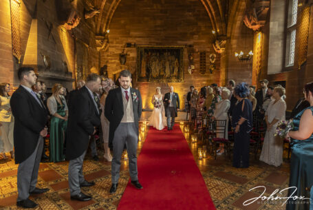 Father of the bride walking her down the aisle at Peckforton Castle