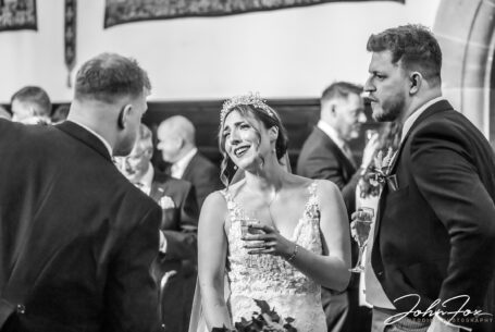 Bride and groom chatting with guests.