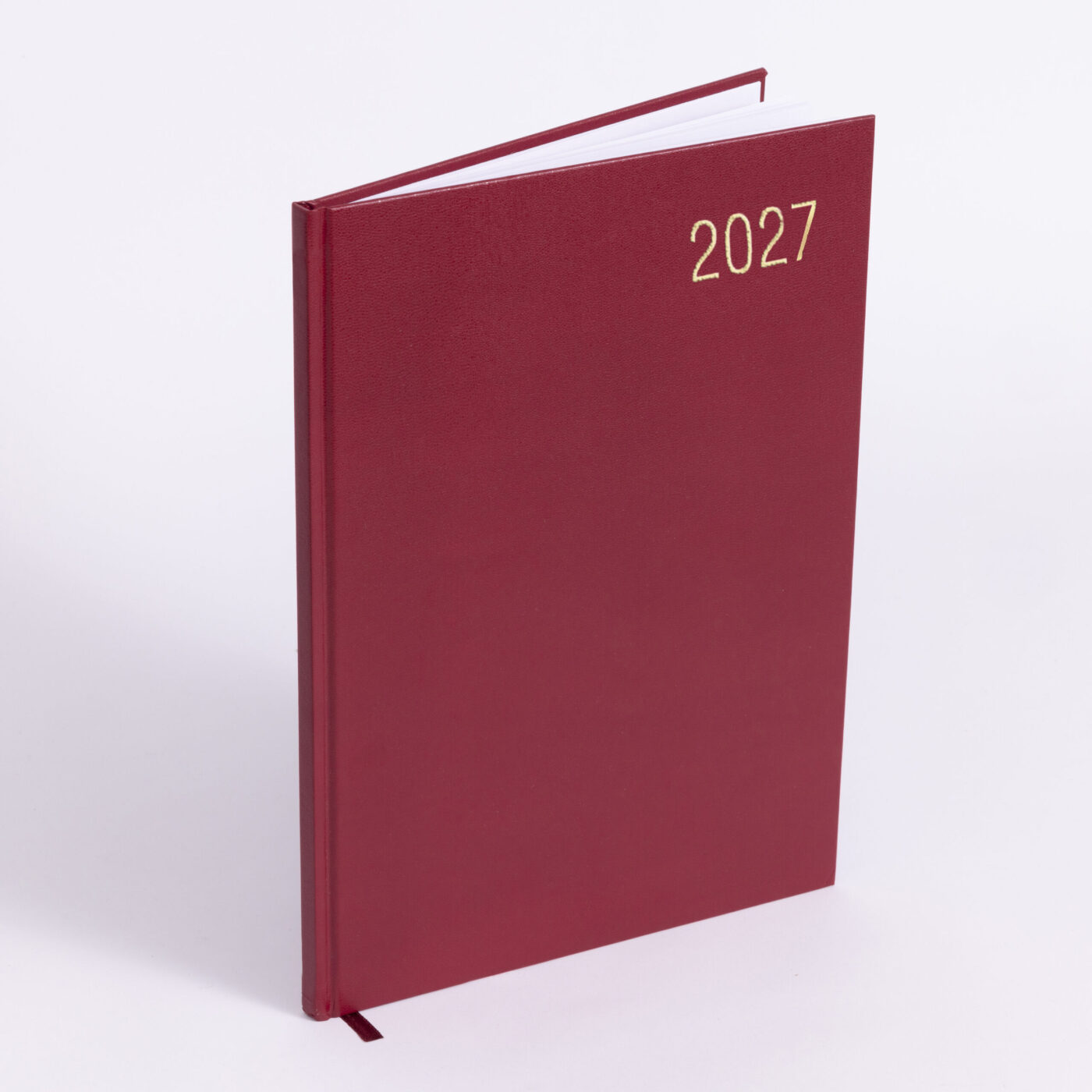 Booking Your Wedding Photographer well in advance. Image of a desk diary with 2027 on the front.