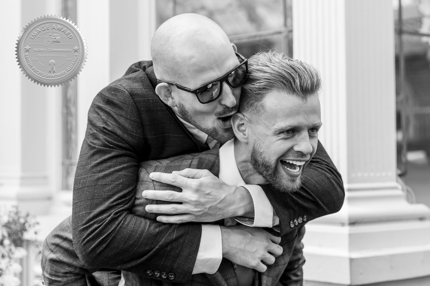 Award Winning Wedding Photographer in Leicestershire. The winning image of a beautifully spontaneous moment featuring two friends