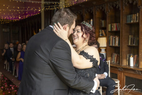First kiss at the wedding ceremony at Ettington Park in Warwickshire