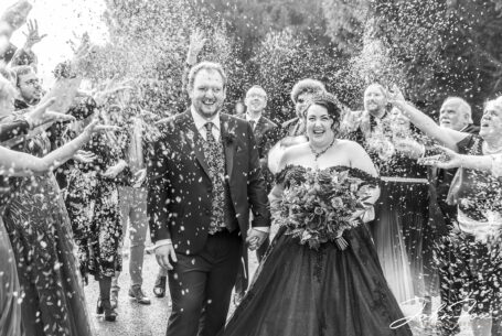 Great reactions from the bride and groom with guests throwing confetti