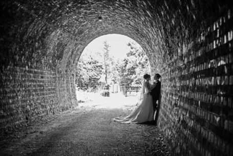 Couple on their wedding day in a tunnel