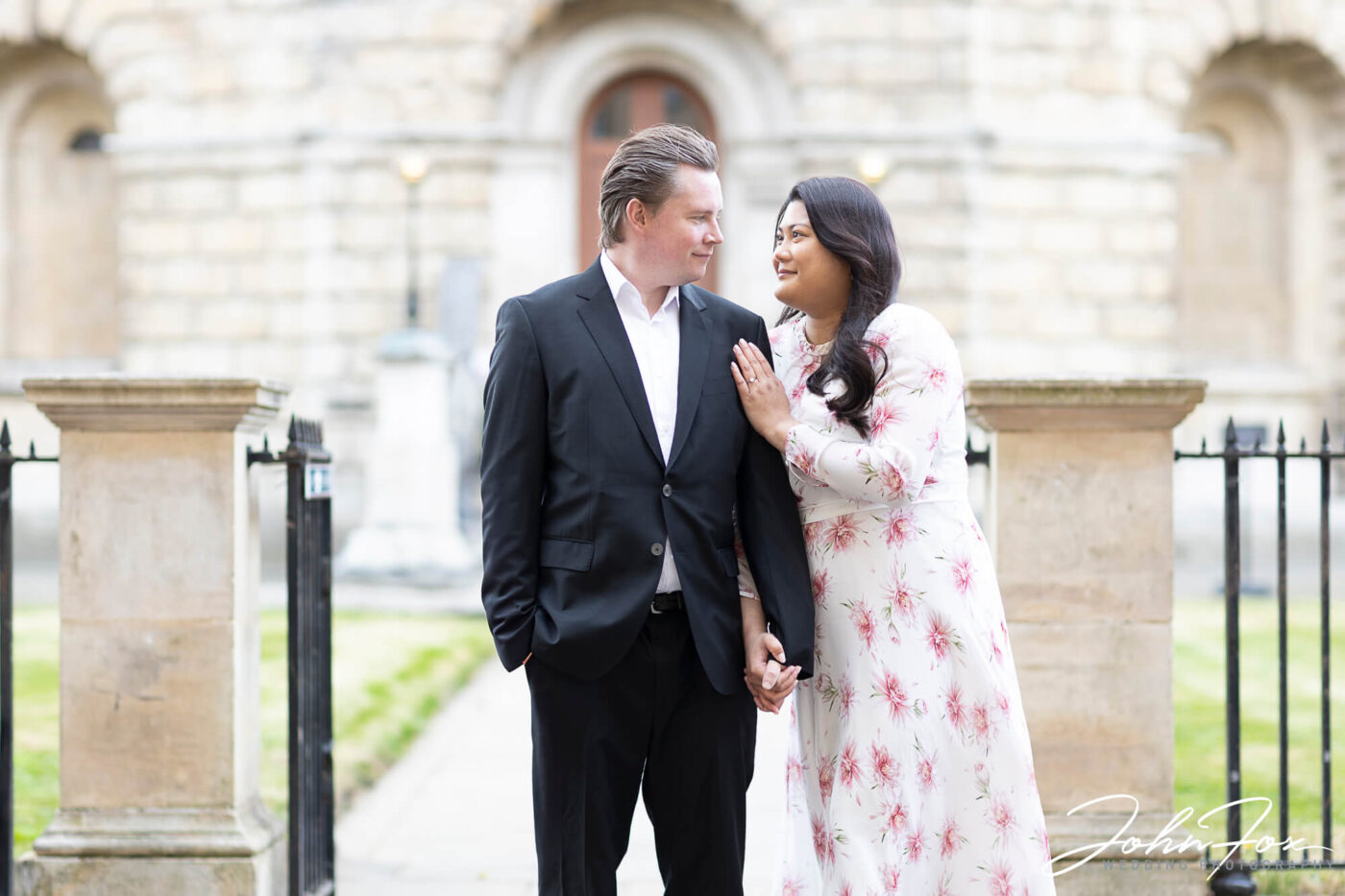 Pre-wedding Shoot in Oxford with couple by the Radcliffe Camera. Image by John Fox Wedding Photography