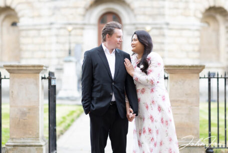 Pre-wedding Shoot in Oxford with couple by the Radcliffe Camera. Image by John Fox Wedding Photography