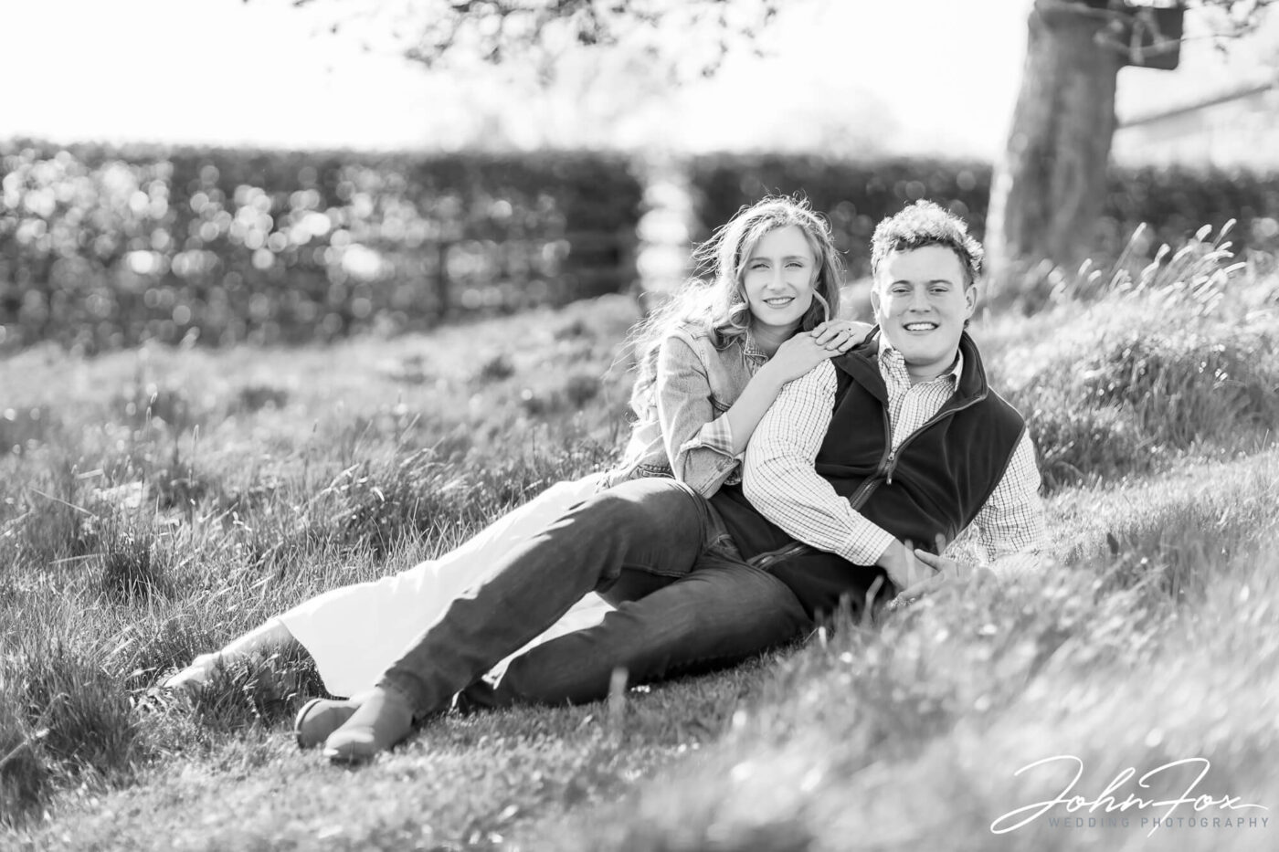 Pre-wedding Shoot in Oxfordshire at Primrose Hill Farm. Black and white image of the engaged couple.