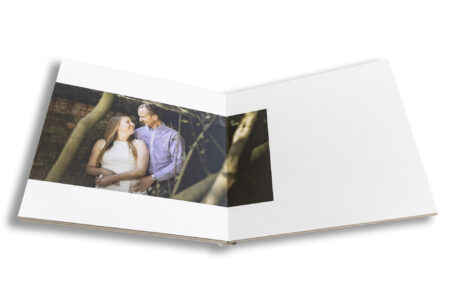 Wedding Guest Book showing image of the soon-to-be husband and wife