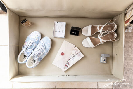 Wedding photography Wiltshire. Bridal preparations image showing brides shoes jewelry and perfume