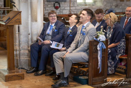 Wedding photography Wiltshire. Groom and the groomsmen relaxing before wedding ceremony.