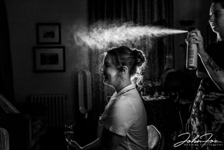 Bride getting ready and the hairspray shot at Ansty Hall