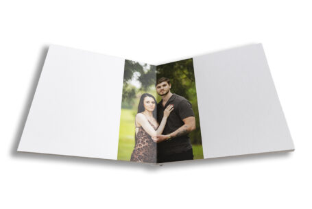 Bespoke wedding guest book photographed at Kilworth House. Pre-wedding photo of the happy couple.