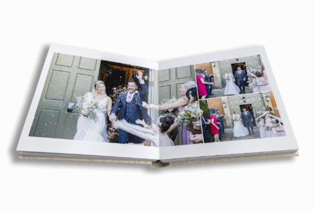 Fawsley Hall Wedding Album image of confetti being thrown over the happy couple.