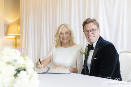 North Yorkshire Wedding Photographer. Bride and groom signing the register.