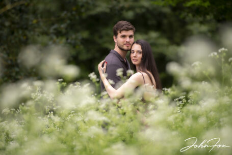 Couple photographed on their pre-wedding in woodland in the grounds at Kilworth House