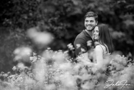 Couple photographed on their pre-wedding in woodland at Kilworth House
