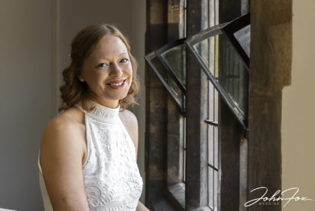 Image of the bride by a window in Stratford-upon-Avon, Warwickshire