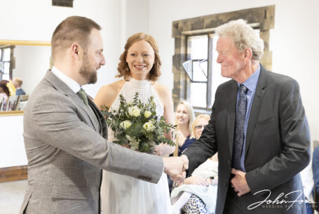 Bride being given away at Henley Room in Stratford-upon-Avon, Warwickshire