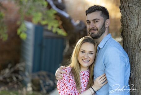 pre-wedding shoot image taken in Warwickshire of the bride and groom with sunlight backlighting the bride's hair