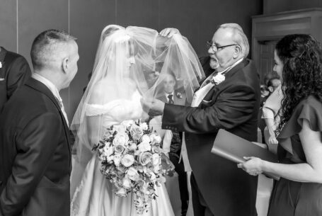 Wedding Photography in Buckinghamshire. Bride's father giving away his daughter.
