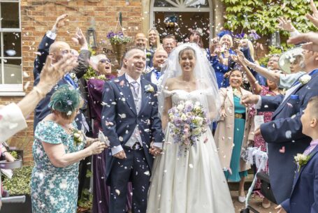Best confetti moment caught by John Fox Wedding Photography: guests all throwing at the same time.