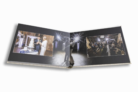 Professional wedding album from John Fox Wedding Photography. Double page spread of the wedding celebrations.