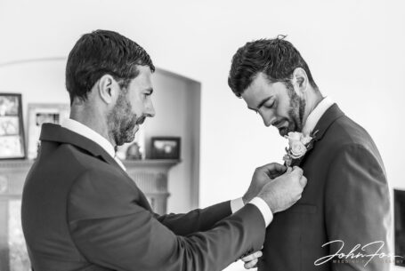 Groom getting ready with best man. Image by Local Warwickshire Wedding Photographer, John Fox