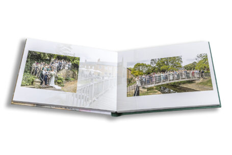 All of the wedding guests on a bridge. Wedding Album of a Leicestershire wedding reception.