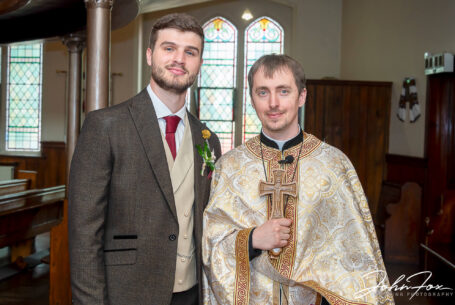 Groom and priest at The Ascension of Our Lord Church in Leicester
