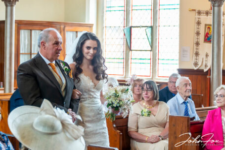 Bride being given away by her father.