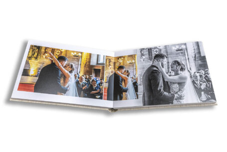 Wedding Album pages showing the bride and groom kissing at their wedding ceremony in Cheshire.