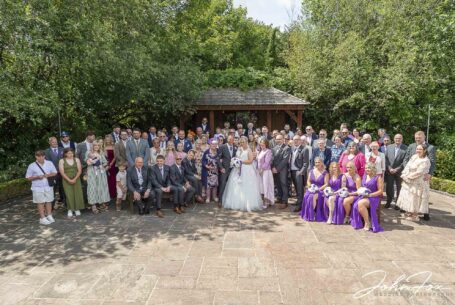 Bride and groom with all guests at Braunston Golf and Country Club in Staffordshire. John Fox Wedding Photography.