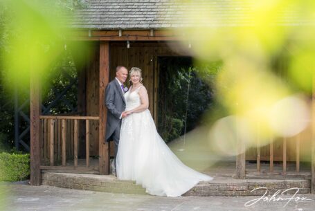 Wedding Photographer in Staffordshire. Bride and groom in the grounds at Braunston Golf and Country Club.