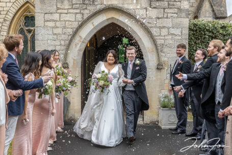 Just married confetti photography taken as bride and groom exit the church in Stroud, UK.