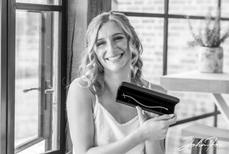 Wedding photographer in Oxfordshire. Bride and a gift from the groom.