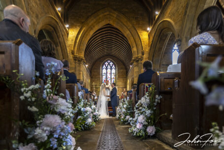 Bride and groom in Radway Church, St Peter’s during the wedding ceremony.
