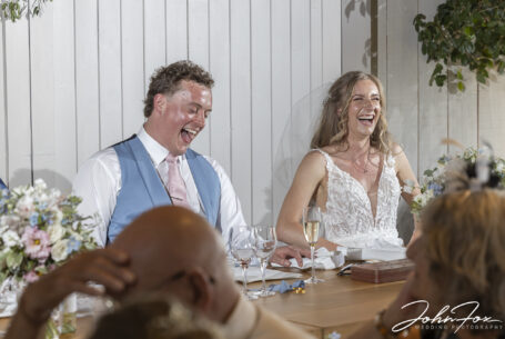 Wedding photographer Oxfordshire at Primrose Hill Farm. Bride and groom reaction to the speeches.