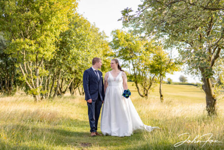 Bride and groom in the grounds at Dunstable Downs Golf Club, Bedfordshire.