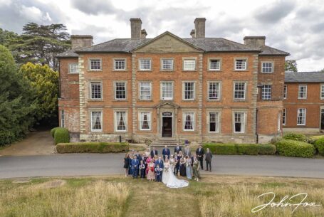 Image taken with a drone at Ansty Hall of all wedding guests. Image by John Fox Wedding Photography.