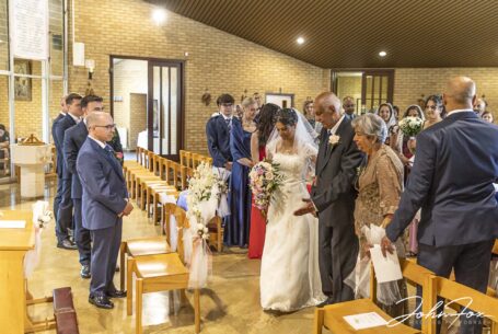 Bride being walked up the aisle by her father