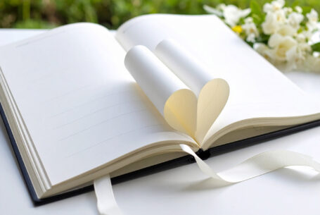 Help Planning Your Wedding Hints Tips and Advice - Introduction. A Wedding Planning book with pages folded in a heart shape.