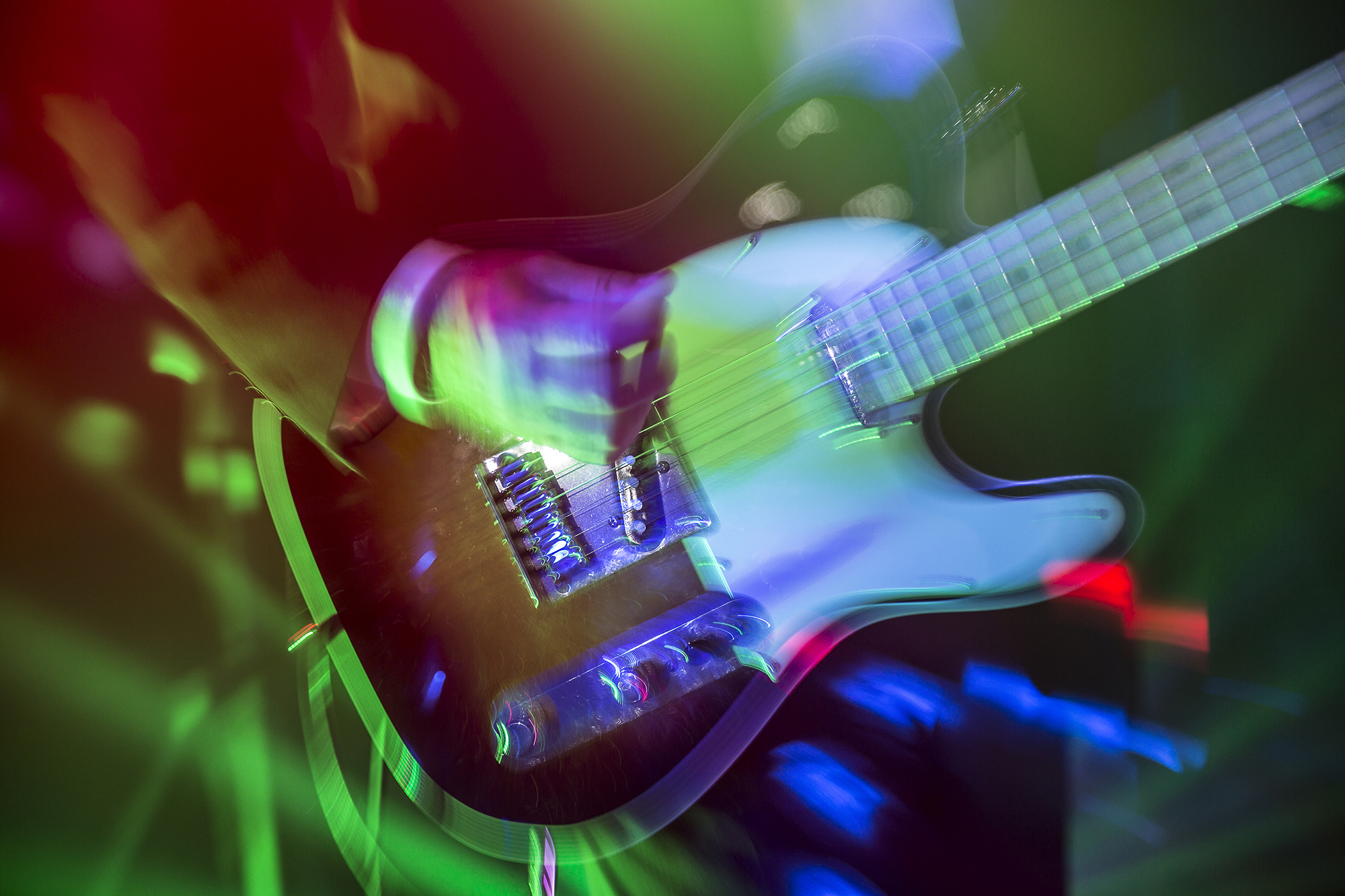 Help Planning Your Wedding Hints Tips and Advice - Entertainment and Finishing Touches. Dynamic image of a guitar being played on stage at a wedding.