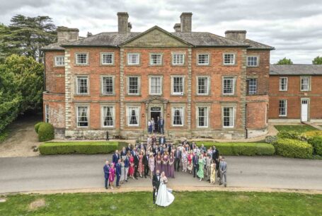 Ansty Hall, Warwickshire: Wedding guests in front of the wedding venue. Aerial photograph taken with a drone.