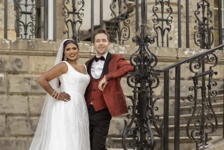 Ragley Hall, Warwickshire: Bride and Groom on the steps leading to the wedding venue.