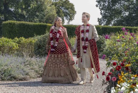 Image taken at Ragley Hall in Warwickshire of the bride and groom in Indian dress walking in the grounds at the wedding venue. Help Planning Your Wedding Hints Tips and Advice – Culture