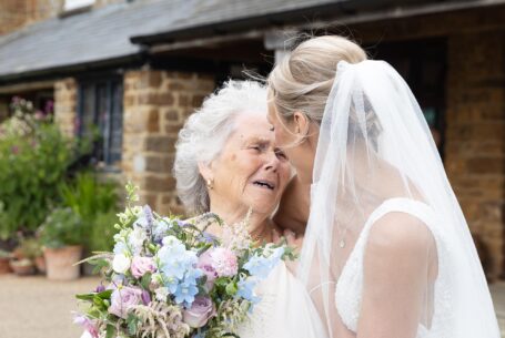 Help Planning Your Wedding Hints Tips and Advice – Part 9 - Bride and grandmother embrace after the wedding ceremony at Crockwell Farm, Northamptonshire.