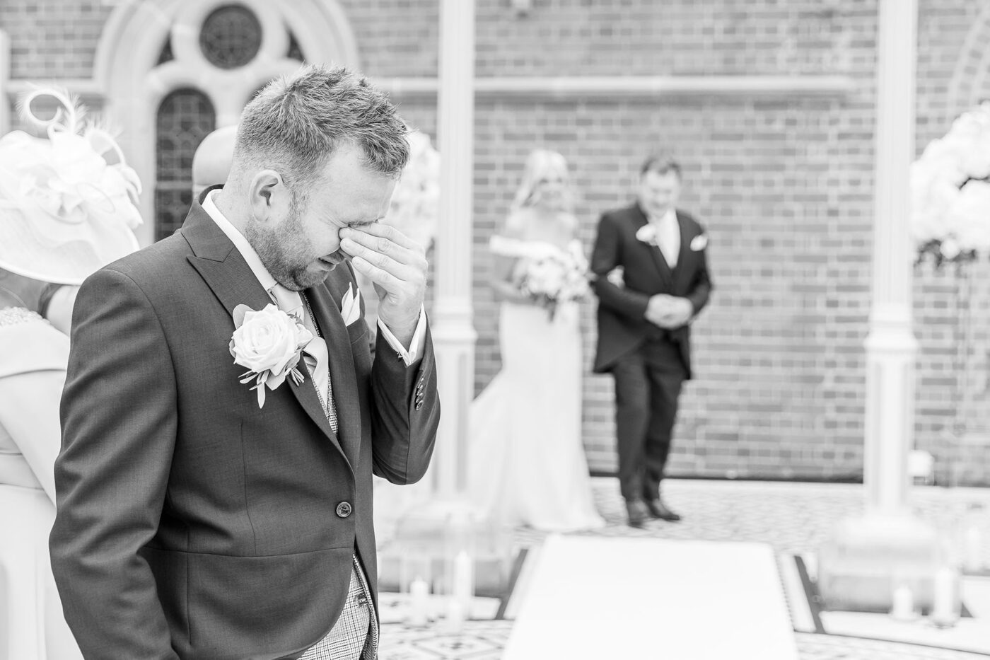 Help Planning Your Wedding Hints Tips and Advice – Part 9 - Enjoy Your Wedding. Image of an emotional groom as his bride arrives at the ceremony.