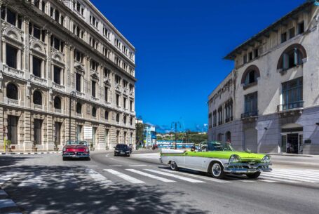 Help Planning Your Wedding Hints Tips and Advice – Part 10 - A street in Cuba, full of vintage cars and ornate buildings and a brilliant blue sky.