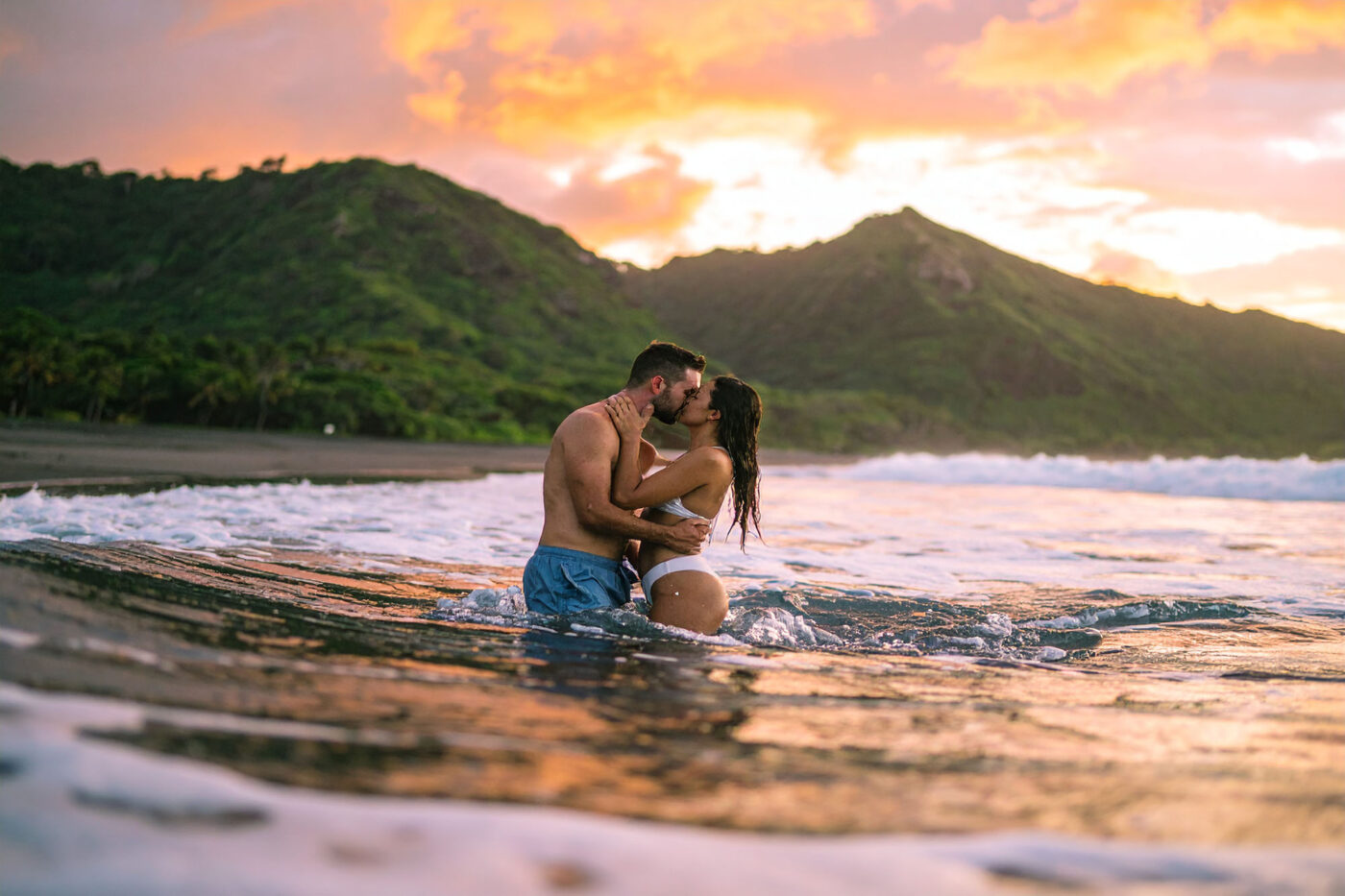 Help Planning Your Wedding Hints Tips and Advice – Part 10 - The newly-weds on their honeymoon. Kissing while standing in the sea and the waves breaking around them.