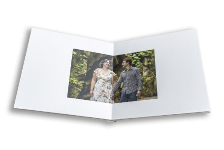 Bespoke guest book showing image of the bride and groom to be Sarah and Lewis at Keele Hall